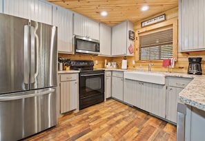 Whip up your favorite meals in this modern kitchen with sleek appliances and plenty of counter space.
