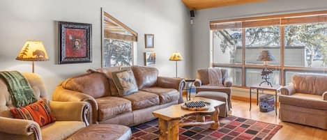 This rustic 3 bedroom, 3 bathroom townhome includes two different living rooms and a private hot tub providing a comfortable space to relax after a busy day exploring.