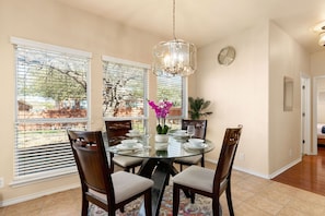 Our dining table is spacious, providing ample room for entertaining and gathering. The carefully chosen furniture and decor create a warm and welcoming environment, perfect for hosting intimate dinners or larger gatherings.