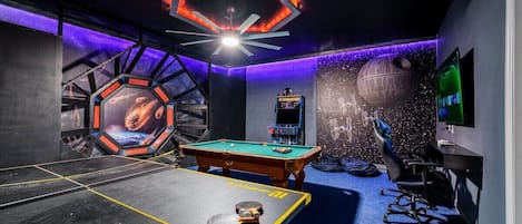 An extravagant entertainment space for the whole family! Star Wars themed game room can be found downstairs.