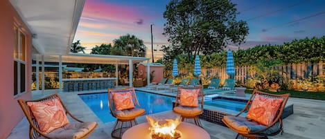 There is a brand new luxury heated pool, hot tub, outdoor kitchen and lounge with a firepit.