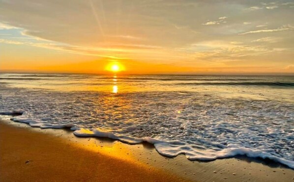 Beach Sunrise. View the sunrise each morning on the Artist's balcony or beach.
