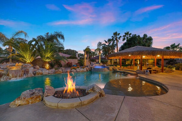 Firepit next to the pool tanning shelf