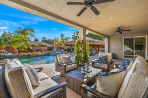 Outdoor living room with couch and TV