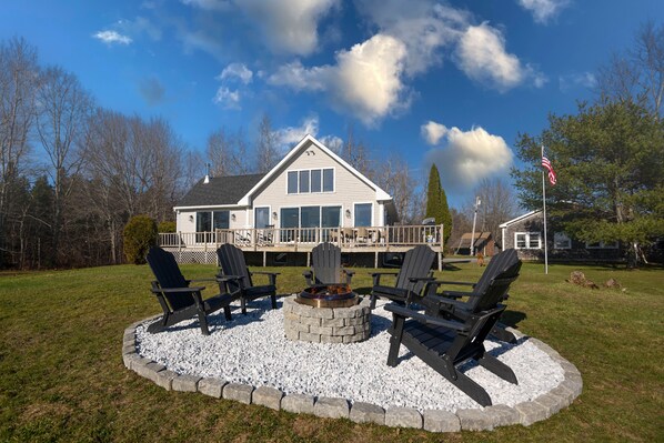 View of fire pit and back of house