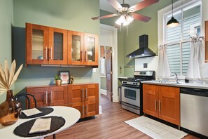 Fully equipped kitchen with a Gas Range Oven, Dishwasher, and Refrigerator.