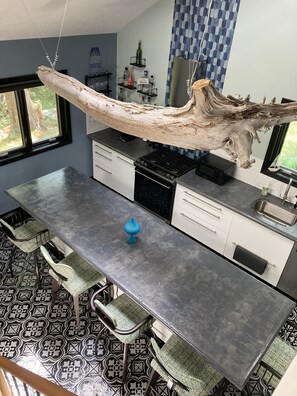 Fully stocked kitchen with gas stove.
