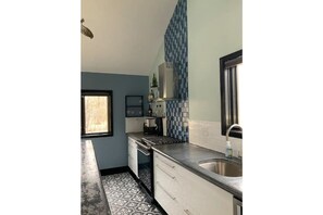 Custom concrete counter tops and glass tile.