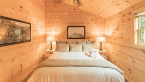 En-suite master bedroom with king bed and high ceilings. Luxury high end mattress and bed linens. Power outlets for charging your phone while you sleep