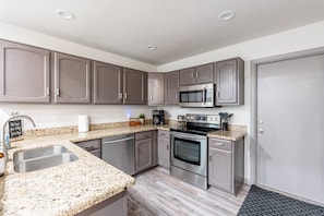 Perfect Staycation - Kitchen complete with all the amenities to make a home cooked meal.