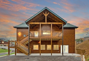 Frontage of the cabin showing access to pool room and the upstairs living area.