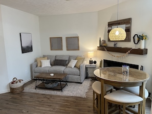 Living room , dining table seats 4 , checkers board game design on the table