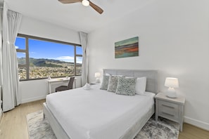 Bedroom with King-size bed, nightstands, and beautiful view.