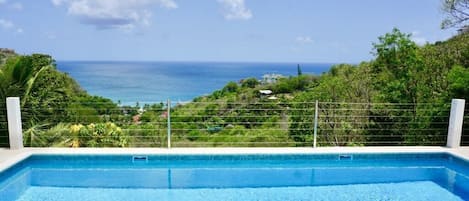 Lounge by the pool & take in the views