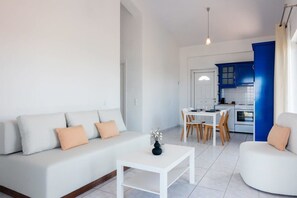 Relax in the sunlit living room where coziness and elegance harmonize