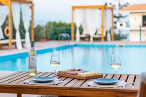 Relax with a drink by the pool