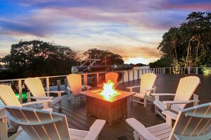 Relax with friends and family at the fire pit and watch the sunset over beautiful waterfront 