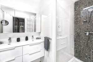 Bathroom with shower and double sink