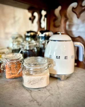 Courtesy Tea and Coffee with Electric Kettle on Antique Sideboard in Dining Area
