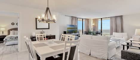 Dining room that flows into living room overlooking ocean