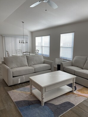LR has couch and loveseat end table and coffee table. 