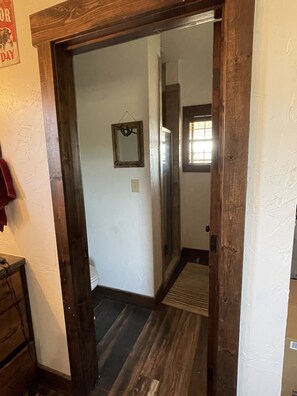 one of the bathrooms with shower and toliet