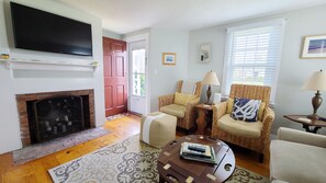 Living room with comfortable seating and flat screen TV