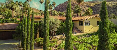 Long private and gated driveway leading to the entrance of the property. 