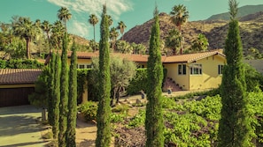 Long private and gated driveway leading to the entrance of the property. 