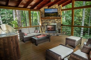 Outdoor Sitting Area with Flat Screen TV, Fireplace, Comfy Couches, and More