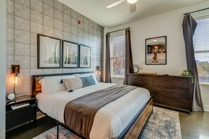 Master bedroom with King size bed, designer furnishings and flat screen TV.
