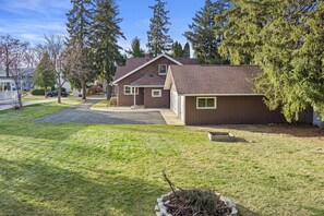 Large Backyard with fire pit overlooking Home and Garage. 