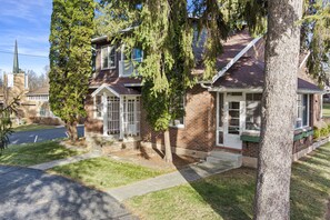 Front yard view in pine tree oasis offering added privacy.