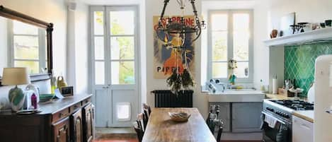 Light and bright kitchen area with  dishwasher and Smeg appliances