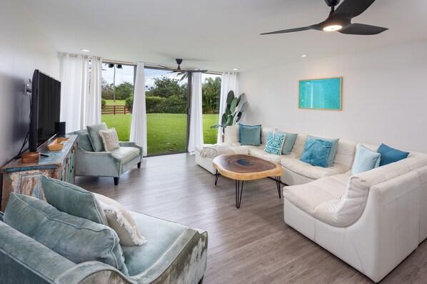 Plenty of seating for everyone to enjoy time together in the living room.