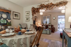 The living room with dining table at Leatside Cottage, Somerset