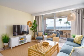 Chill out in this breezy, beachy living room with epic ocean views—just steps to the lanai for sunset drinks and good vibes. Your island escape starts here!