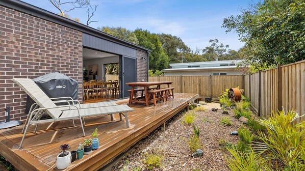  The deck has comfy lounge chairs and an outdoor dining area, perfect when you want to enjoy the morning chill or spend the afternoon watching sunsets.