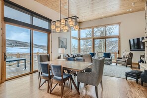 Enjoy the surrounding views while dining. Dining seats 6 at table with 4 breakfast stools not pictured