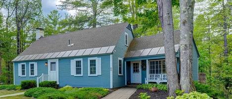 Front exterior of house with large pull through driveway