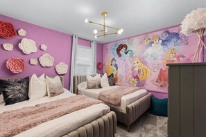 Three kids’ rooms have fun themes like this one that celebrates Disney princesses.