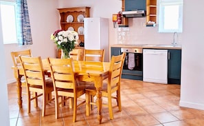 Dining Table and Kitchen at Dingle Harbour Cottages