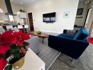 Relax in this cozy velour sofa after a long day.