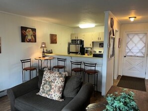 Comfortable living area with a bar seating, perfect for relaxation.