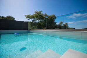 Relax and revive around the pool