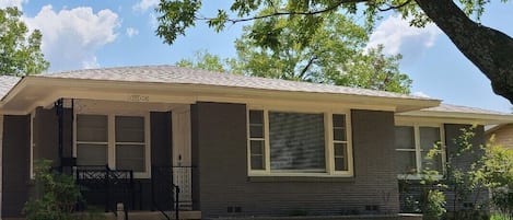 Front porch of Duplex. Room is connected but not shared by another living space.