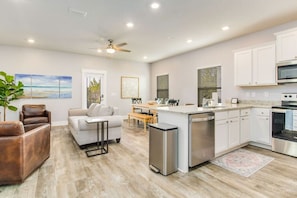 With this open concept living room, dining area and kitchen, you can be with your family or friends in the living room while cooking in the kitchen.