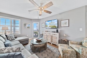 The upscale furnishings and gorgeous beach views make the living room the heart of the home.