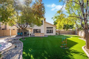 Huge back yard with turf plenty of room for yard games