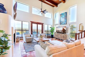Open concept living space with picturesque windows